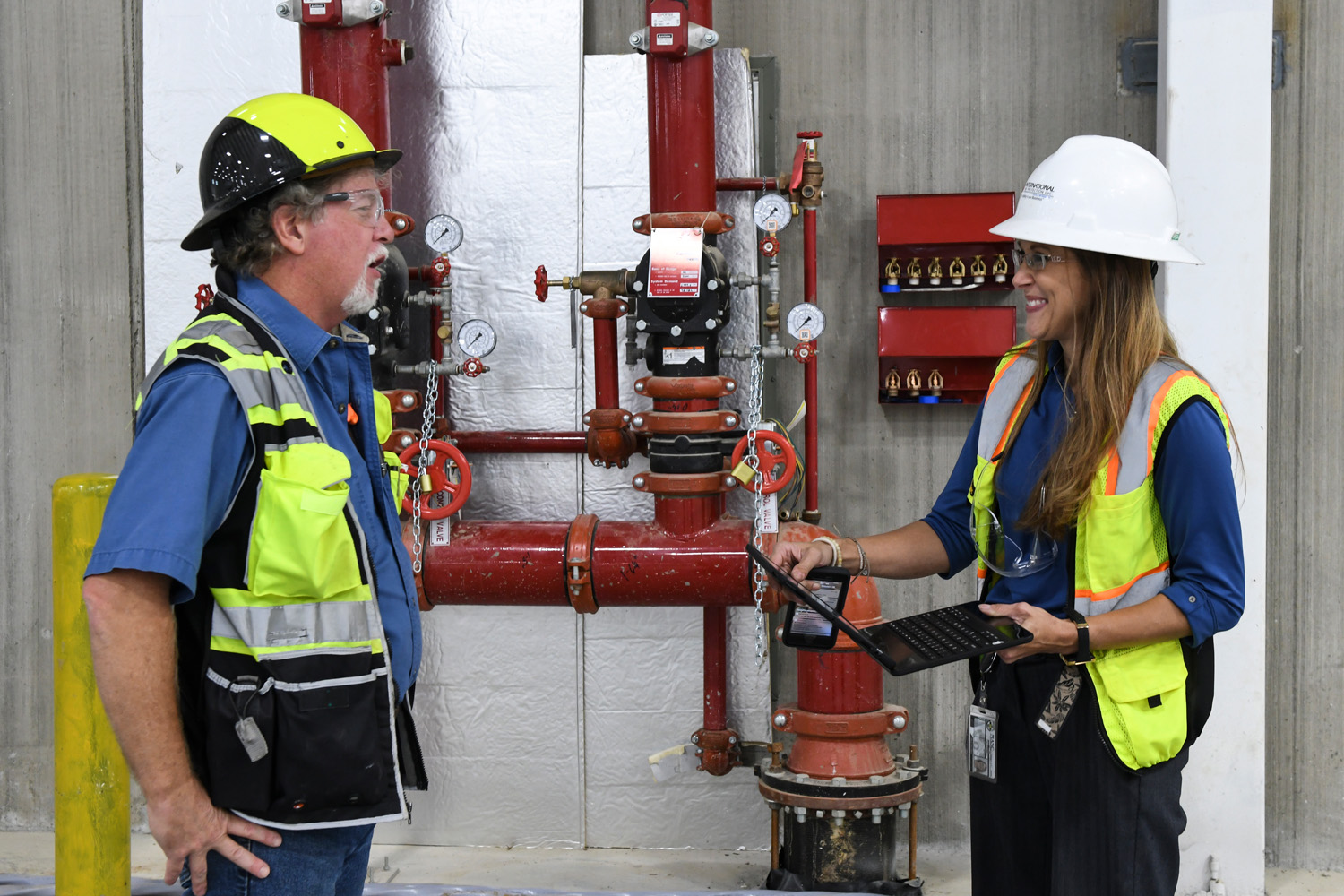 A coworker wearing safety gear on a job site for International Fire Protection, Inc.