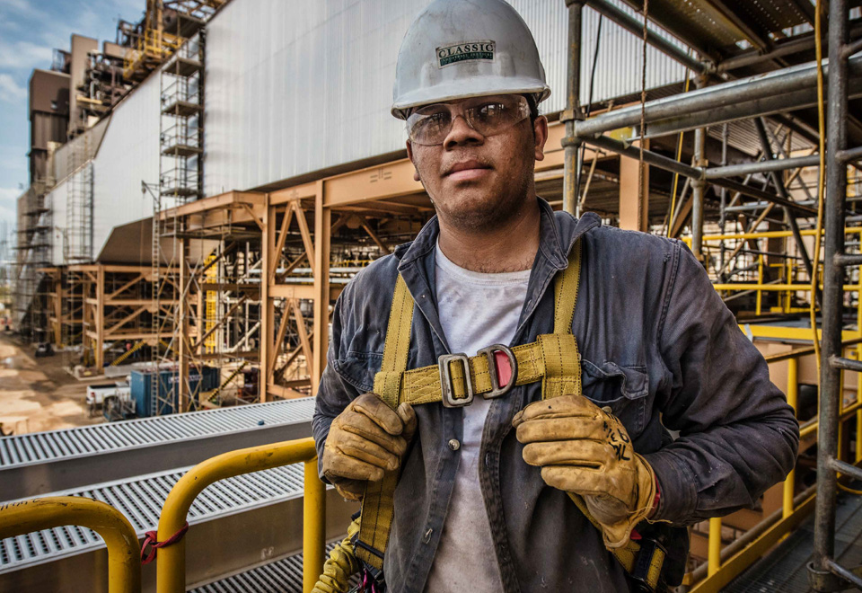 Worker wearing a safety harness.