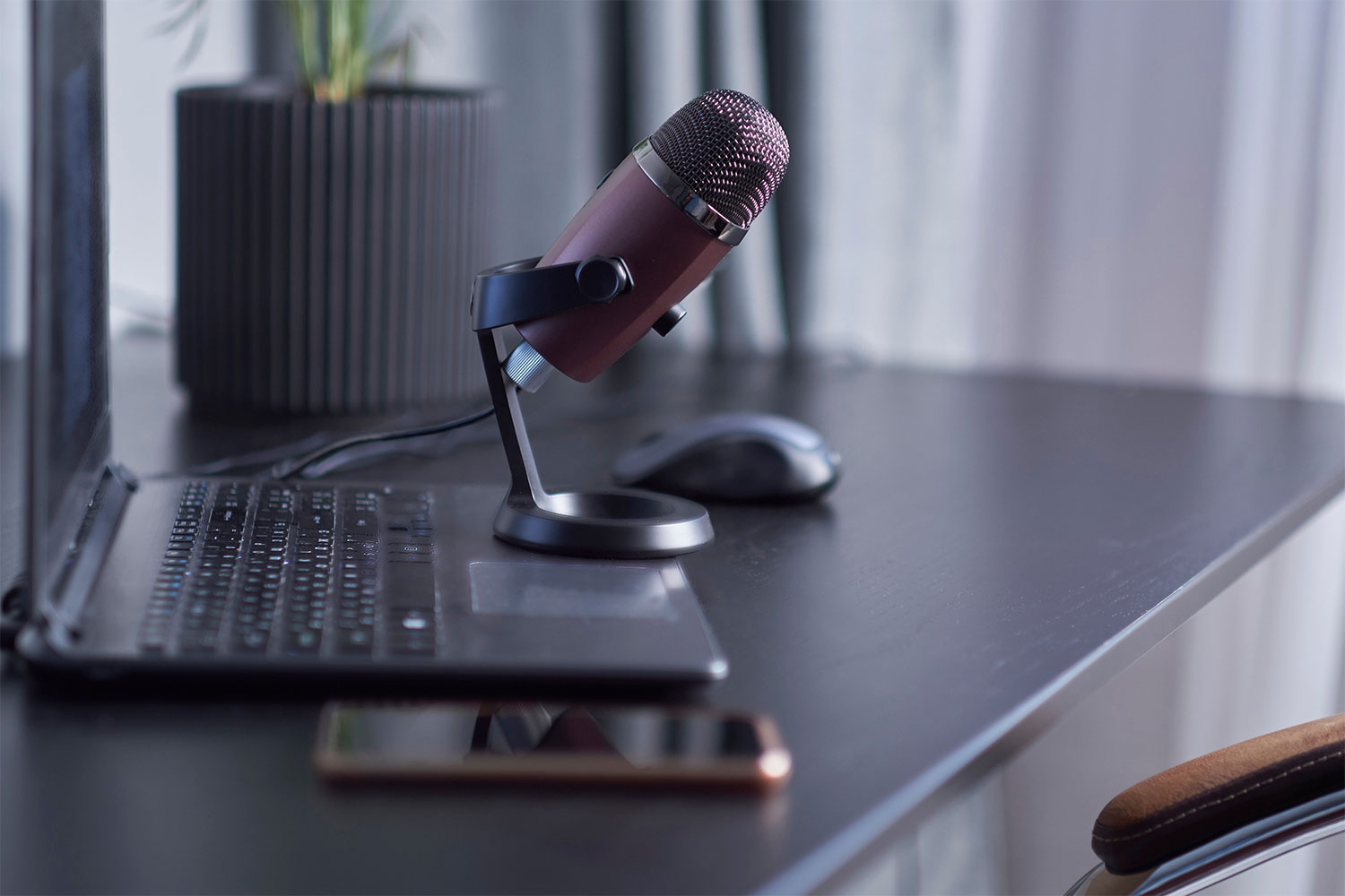 A microphone, laptop and mobile device.